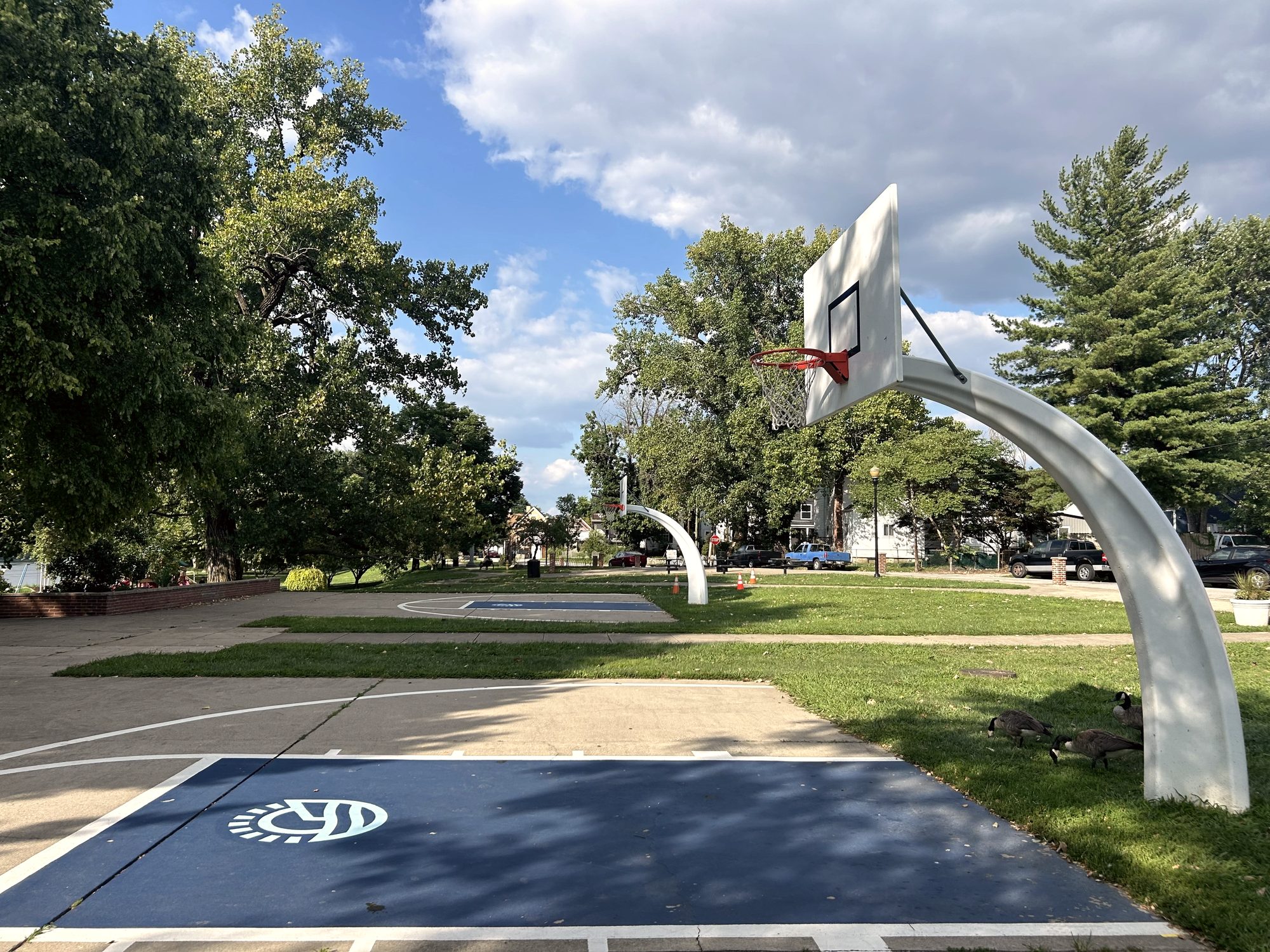 Empty outdoor basketball court at Bellevue Beach Park on a clear afternoon