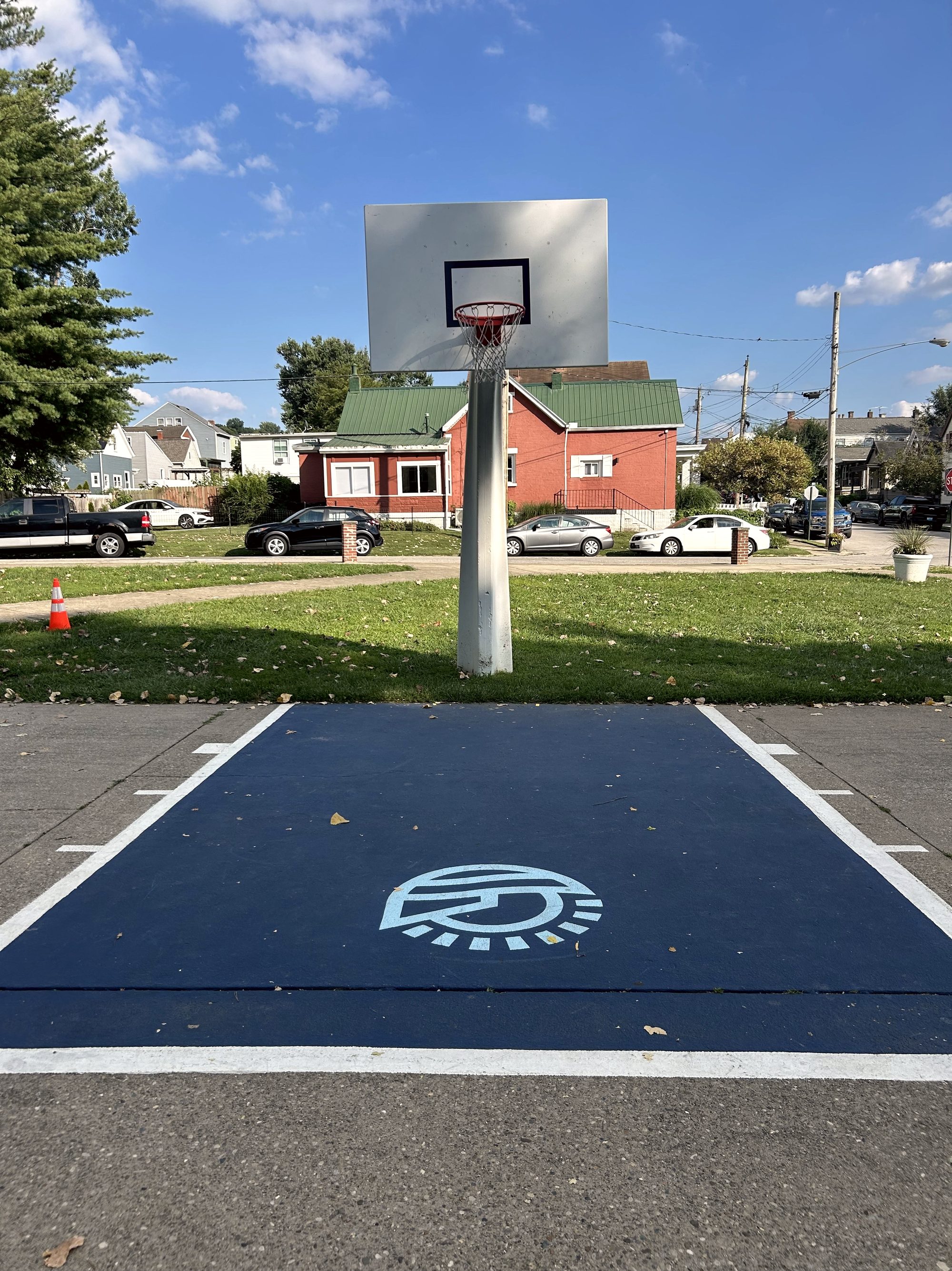 Painted blue key and backboard on the outdoor court at Bellevue Beach Park