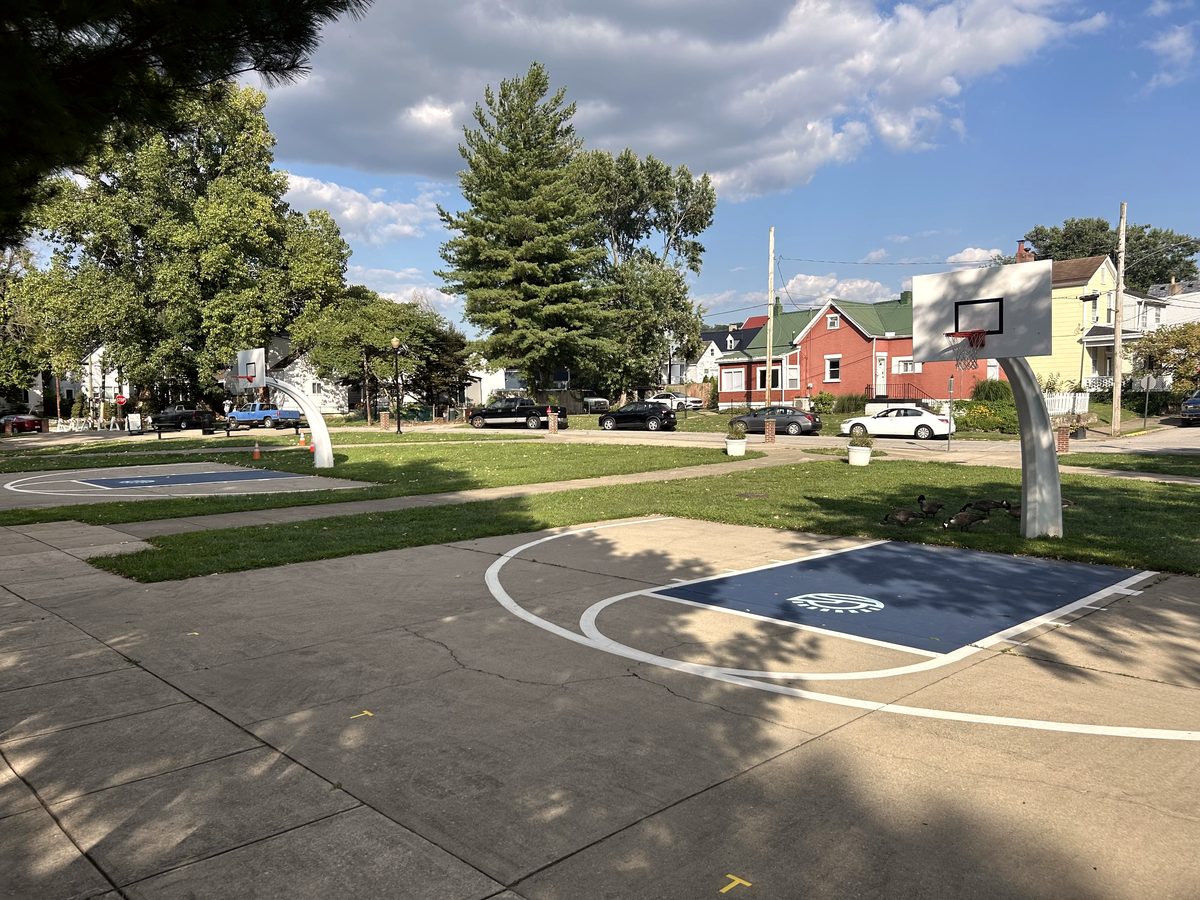 Two outdoor courts with painted blue keys at Bellevue Beach Park