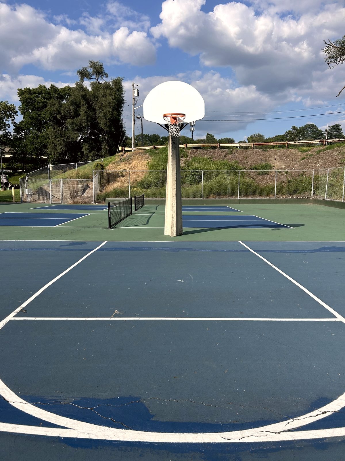 Blue and green hard court with basketball hoop in Newport, Kentucky